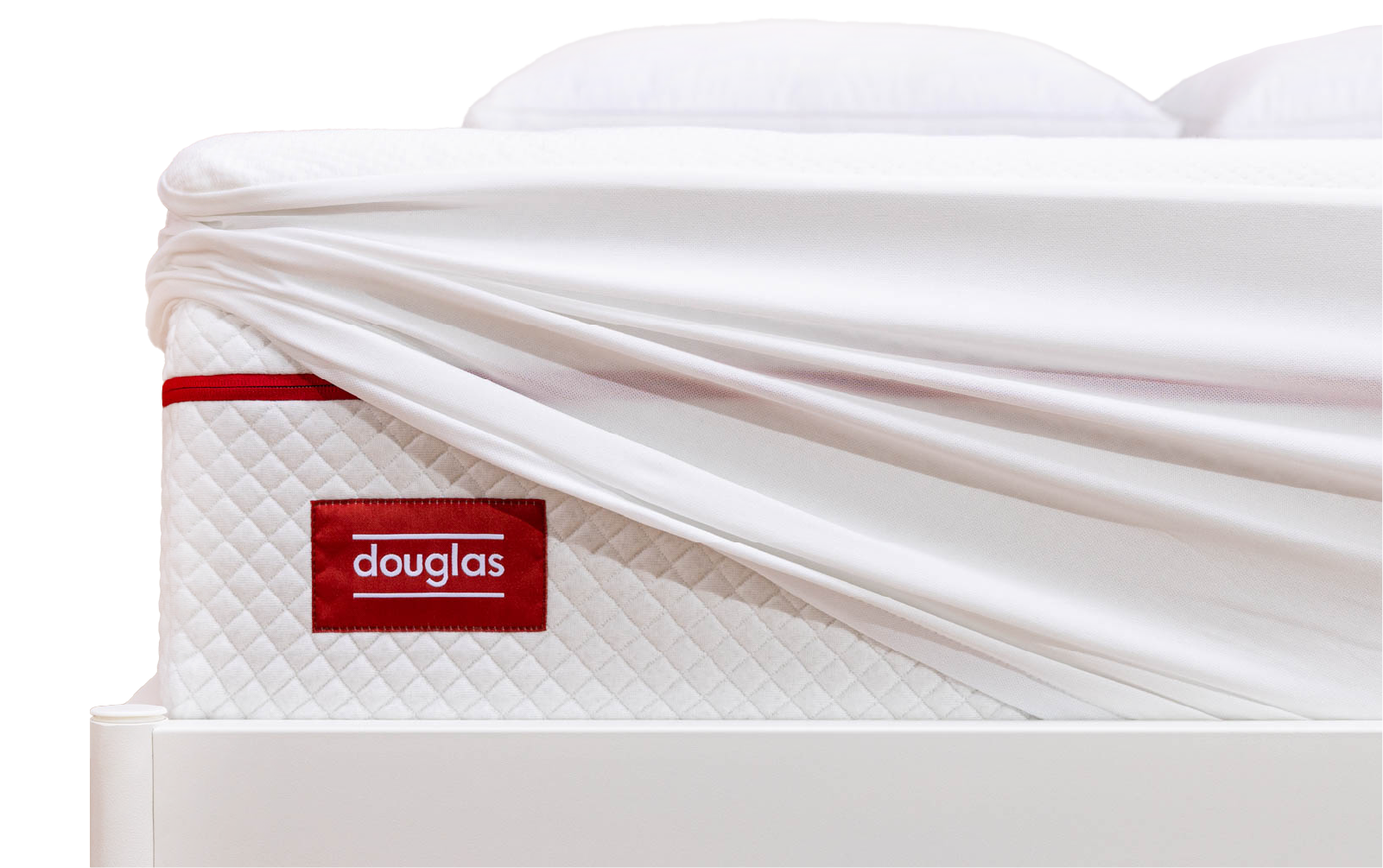 photo of a mattress protector being pulled away from a Douglas mattress