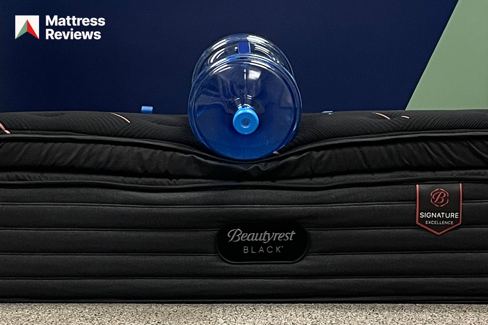 photo of water bottle lying on the edge of a Beautyrest Black mattress to demonstrate edge support