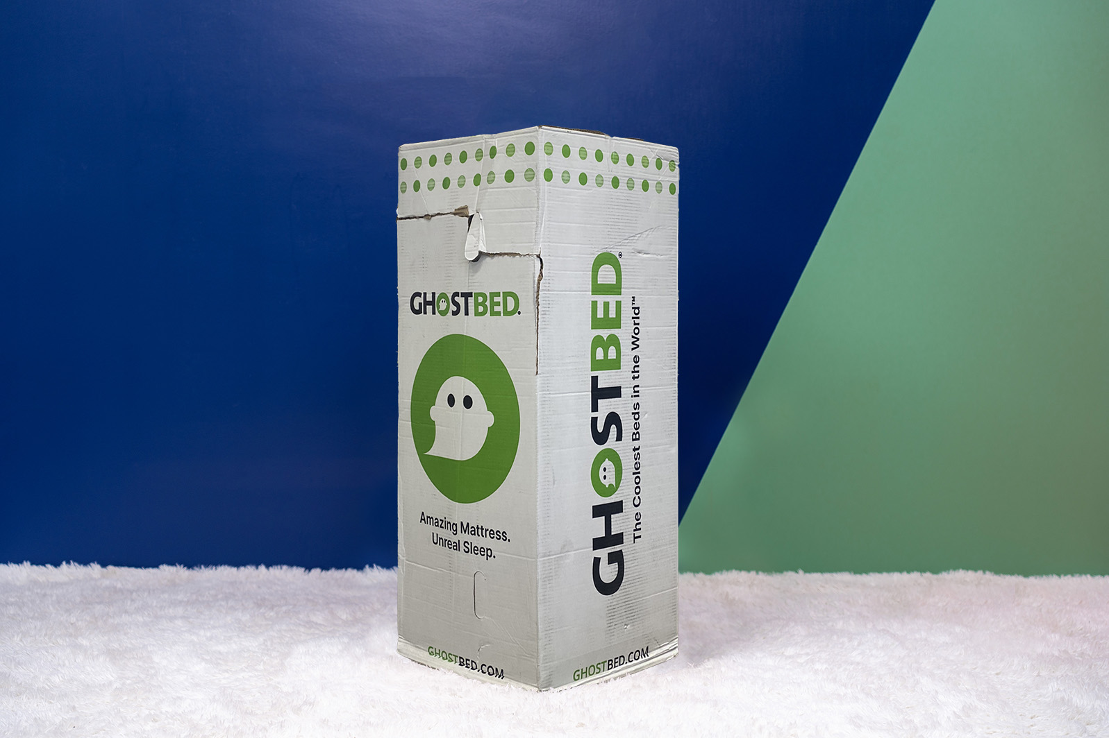 GhostbedComfortFoamBox MattressReviewsca GhostBed Comfort Foam mattress delivery box on a carpet in a room