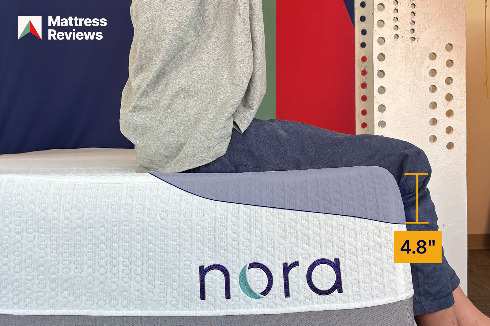 mannequin sitting on a bed showing 48