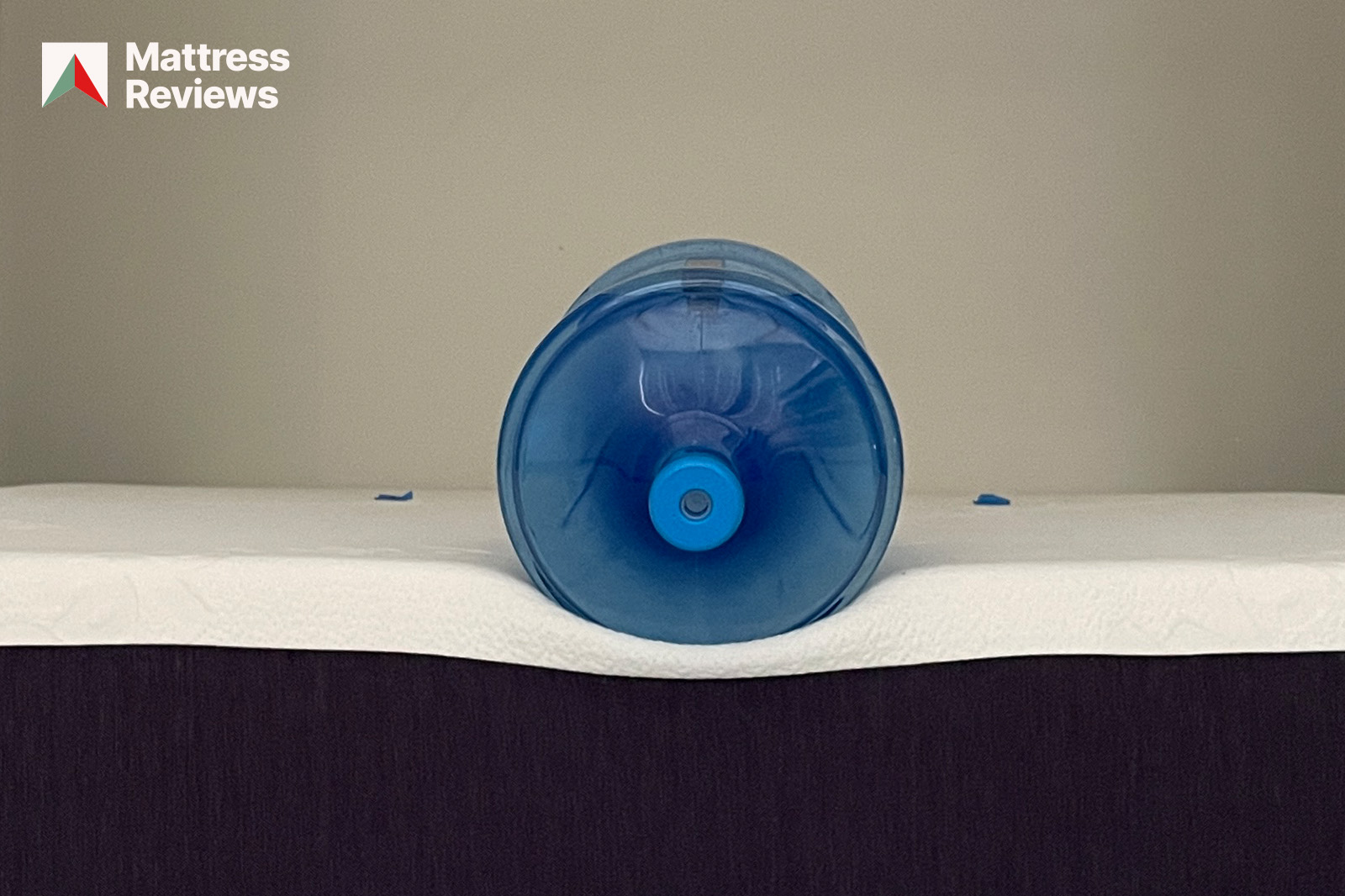 Water bottle on edge of Polysleep Origin mattress to demonstrate edge support