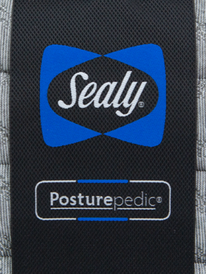 A close-up photo of the Sealy Posturepedic mattress tag. 